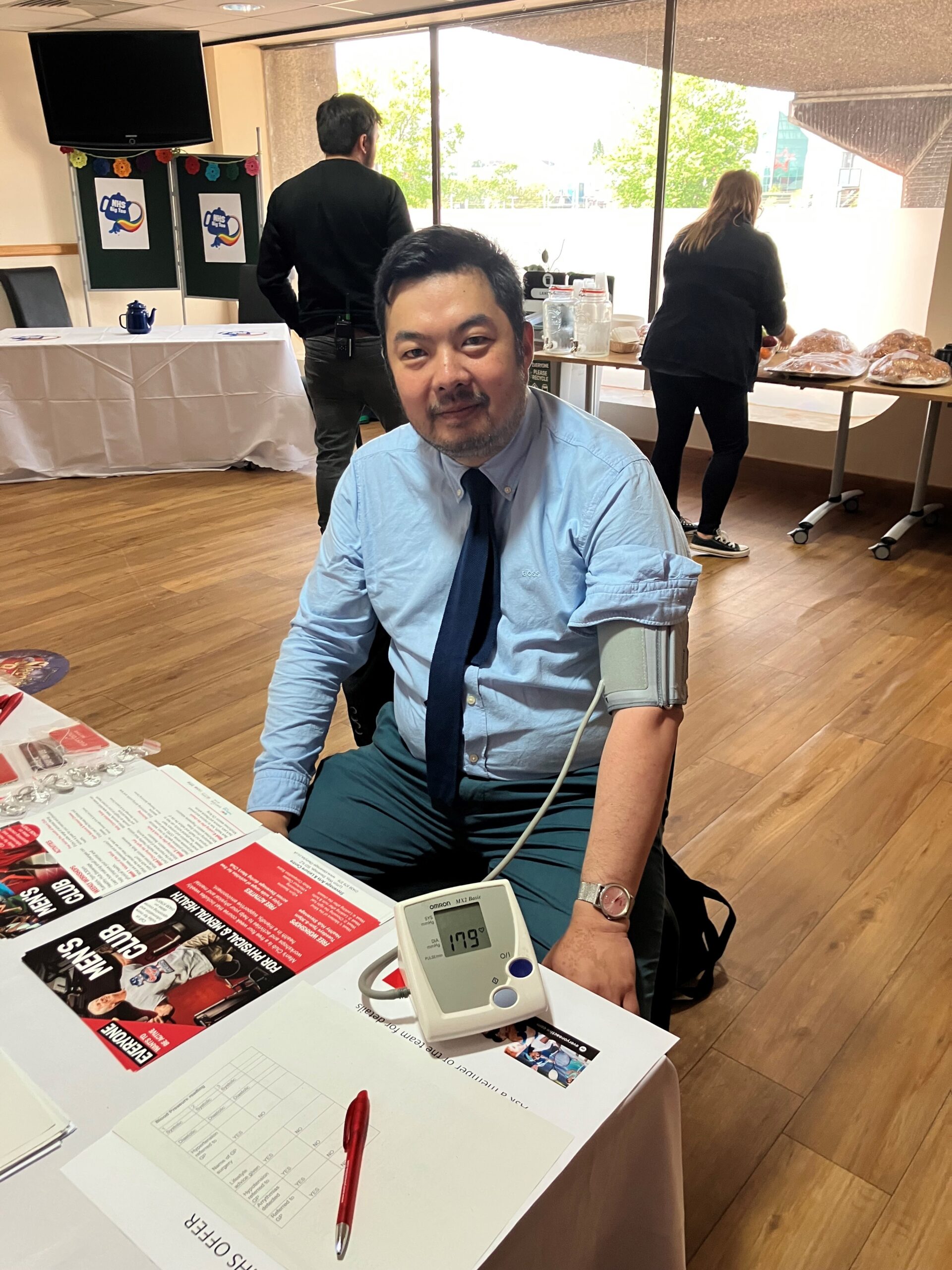 Dr Mark Lim having his blood pressure taken