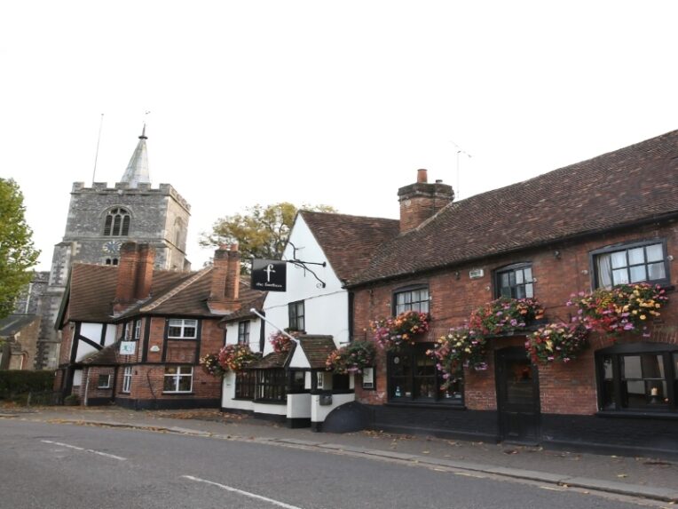 Old church next to a charming old pub