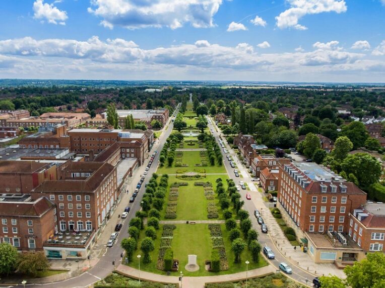 Aerial view of older buildings and symmetric park