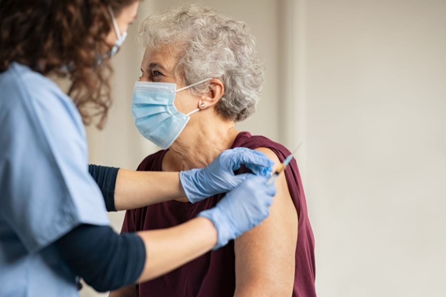 Older woman receiving vaccination