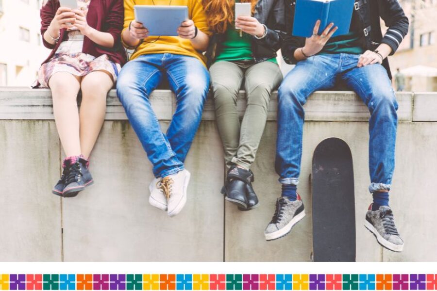 Teenagers sitting on a wall